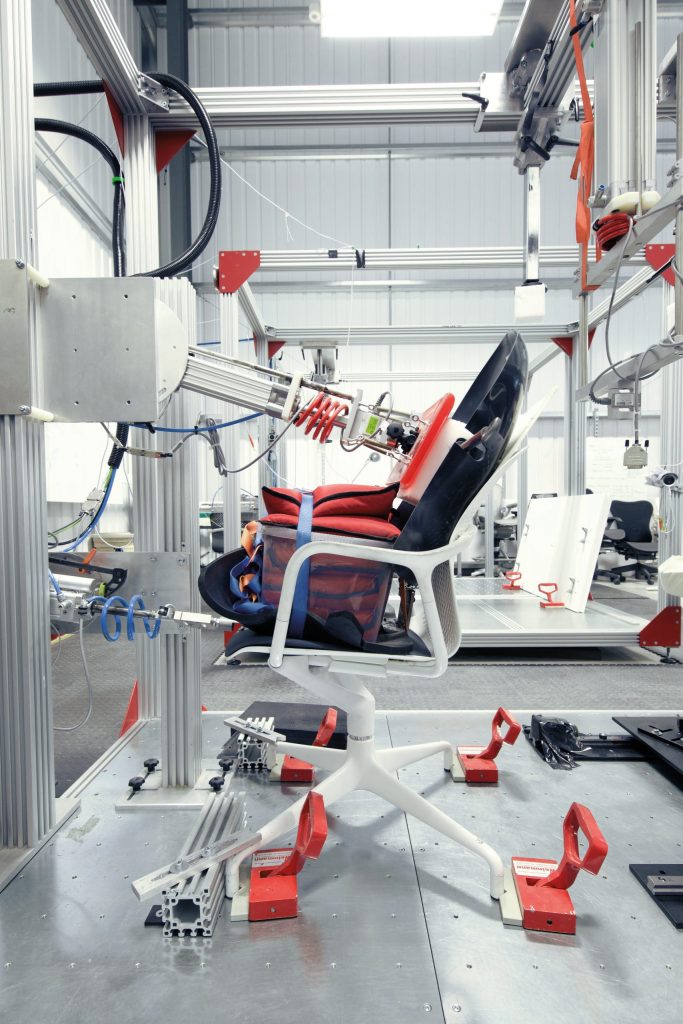 Photograph of the Keyn chair undergoing its million-cycle testing at Herman Miller's test lab.