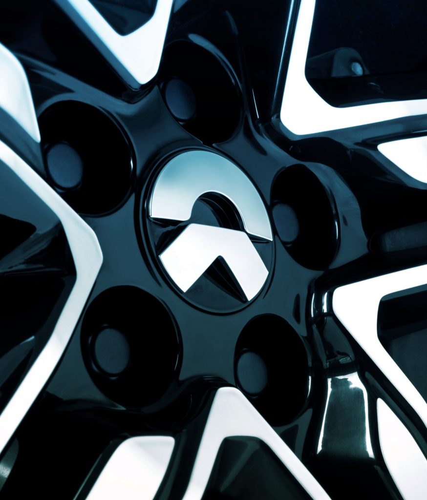 forpeople's brand identity work for NIO. Close-up photograph of the wheel of NIO EV.