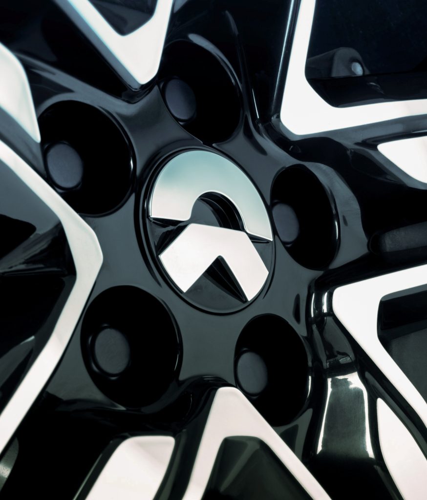 forpeople's brand identity work for NIO. Close-up photograph of the wheel of NIO EV.